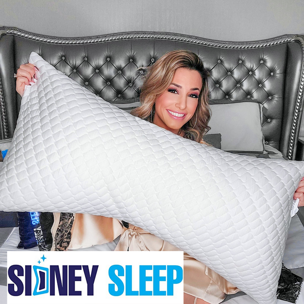 Danielle Cabral holding the Sidney Sleep Pillow