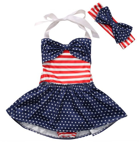 One piece flag inspired bathing suit with big bow and white halter straps. Set comes with matching headband with a big blue polka dot bow. 