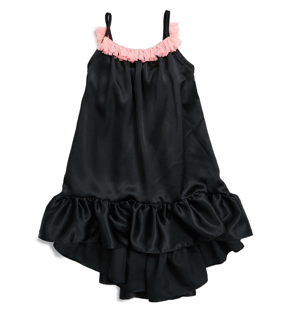 This gorgeous silk dress is just what the beautiful summer weather calls for. This slinky silk bodied dress comes higher in the front and longer in the back turning a fun dress into a fancy party outfit. The front and back are lined with hot pink tassels. Your mini diva will love to give this dress a twirl.