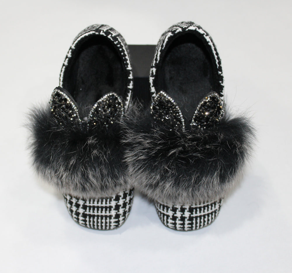 faux fur bunny ear shoes. The bunny ears are filled with black and charcoal rhinestones. 