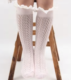 Our Knee High socks can be worn by mini fashionista's ages 3-6. We have two colors; Powder Blue and Pink. Each sock comes with a white ruffle lace located at the top and a structured pattern throughout the entire sock. Add these adorable accessories to any skirt or long blouse to create a fabulous mini diva look! 