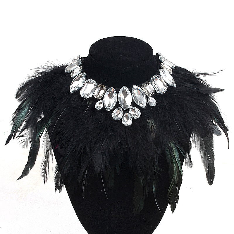 Our Diamond Glitz necklace is stunning!  This makes the perfect addition for our mini diva's all the way up to our mama diva's.This necklace sits high on top of your existing shirt and is lined with Solid black and hints of evergreen long feathers and shining crystals.  Mix and match with your mini for the perfect stylish accessory! 