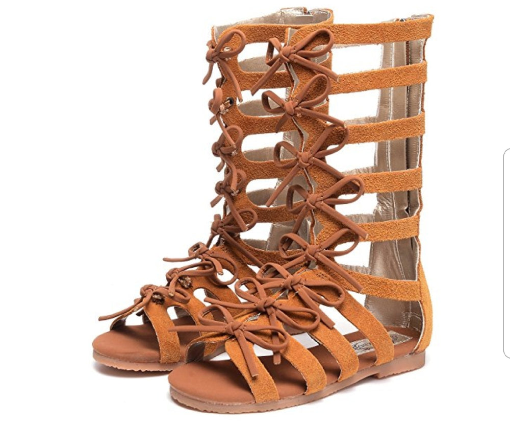 These zipper back gladiator open toe shoes have bows lining in the front. The light suede finish turns these boots into comfy casual or a dressy finish for the perfect outfit. 
